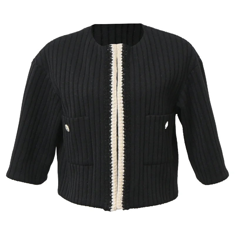 women's coats for those who value both style and comfortChanel Cruise 2022 Knitted Collarless Jacket with Pockets in Black Polyamide